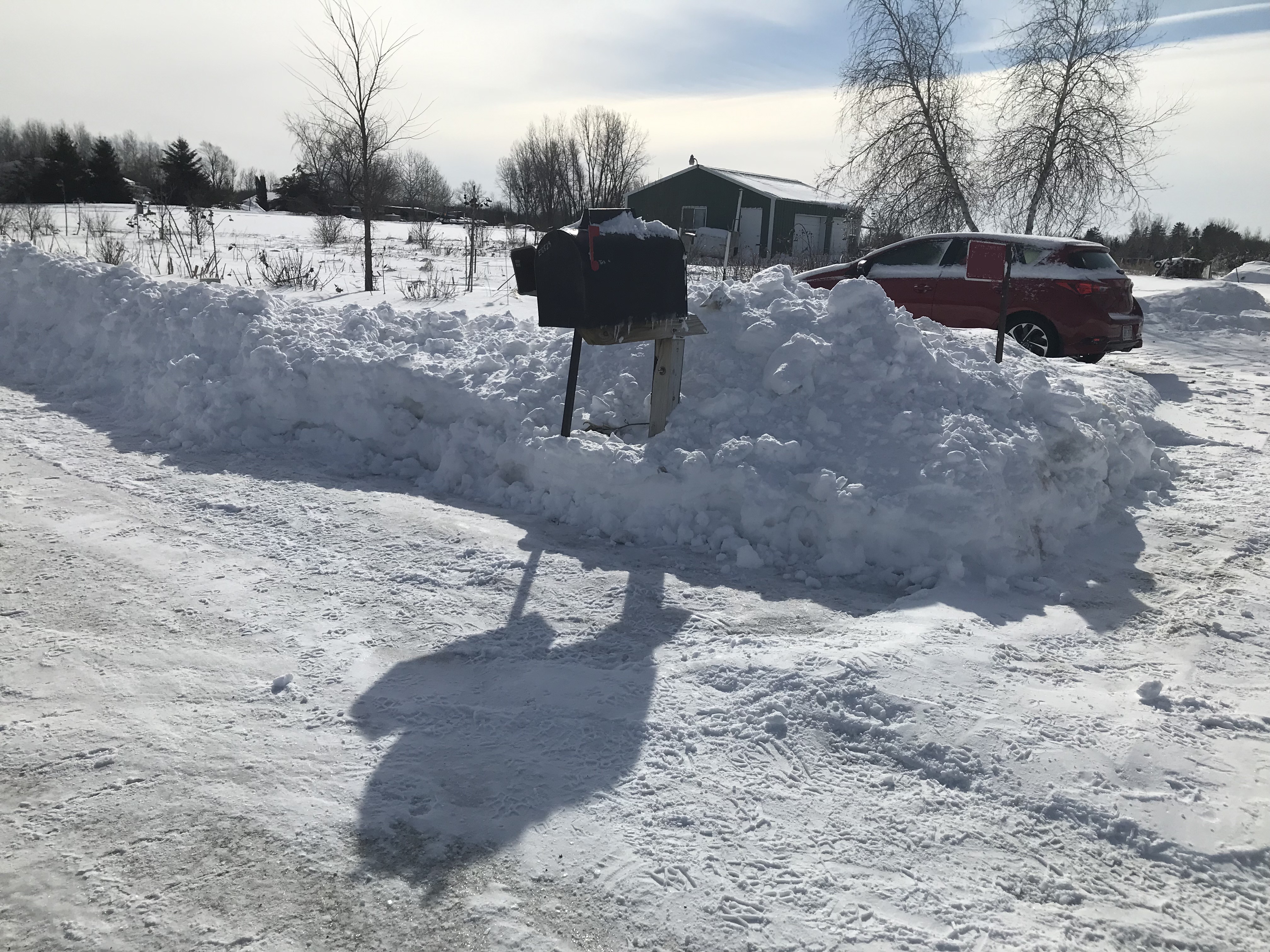 Plowed road with snow ridge