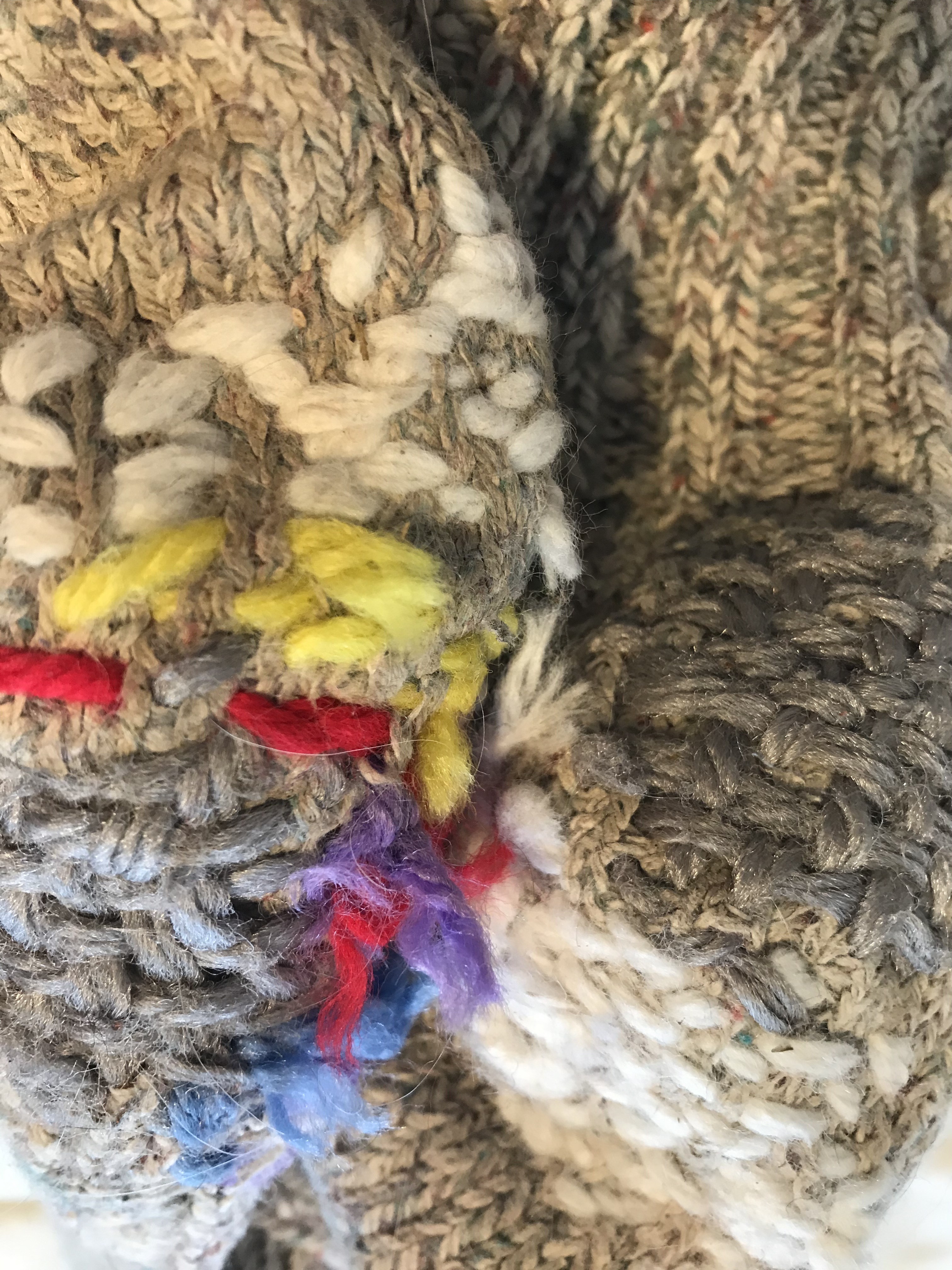 Close-up of darned sock heels